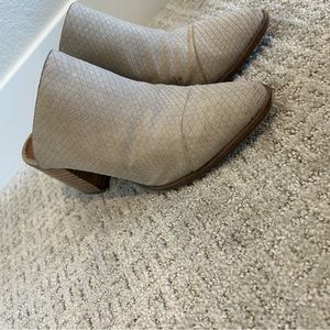 Woman’s grey ankle boot.